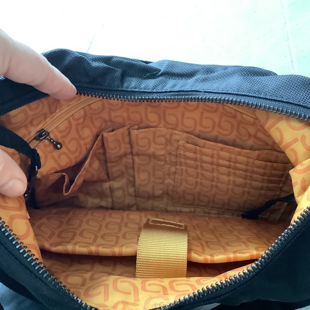 Baggallini Tote with matching wallet/pouch Like New. Padded tech-organization